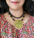 Two layer black beads with green kemp stones Neckpiece