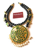 Two layer black beads with green kemp stones Neckpiece